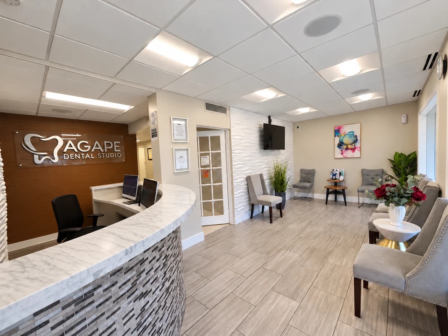 Agape Dental Studio reception and waiting area with the practice wall sign
